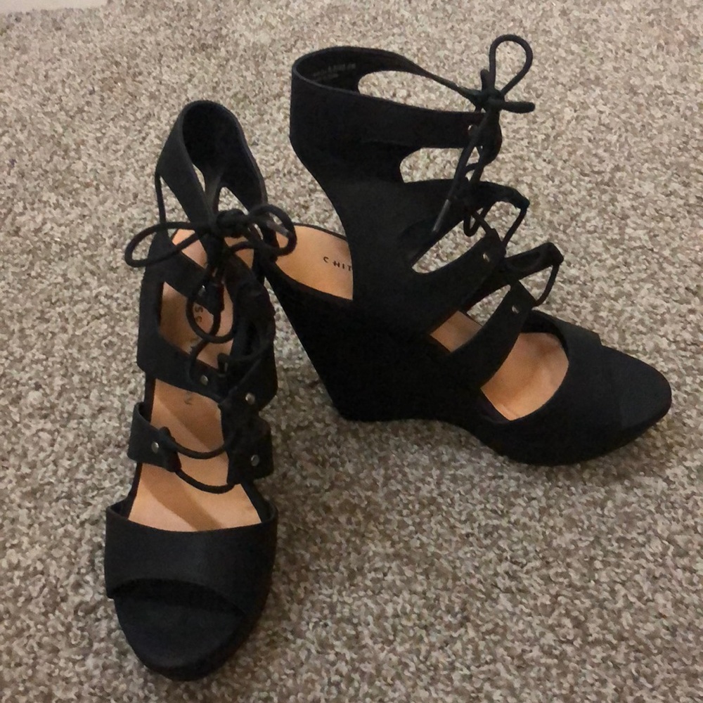 NWOT black lace up wedge heels.  Never worn in excellent condition!